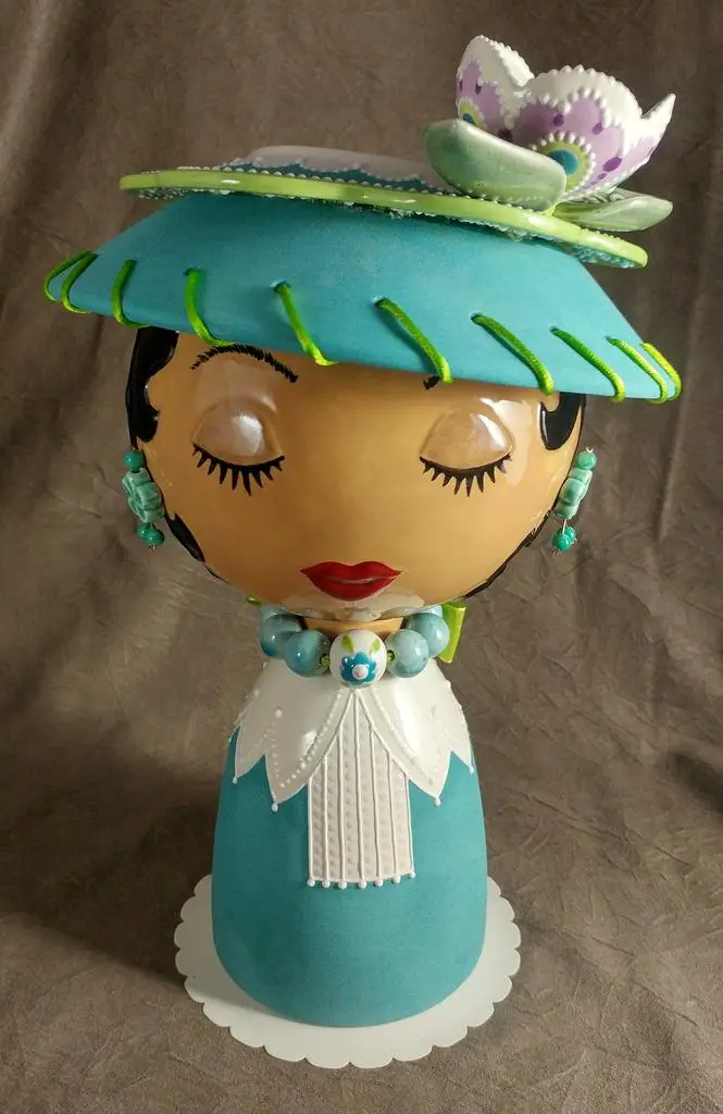 Copy of 20180919_100436_HDR-1(1)Eugenie - ©Stephanie Barken - Cut and glazed bisque with found objects and artificial greenery. NOT intended to hold water - 8.5dia x 14h - $475