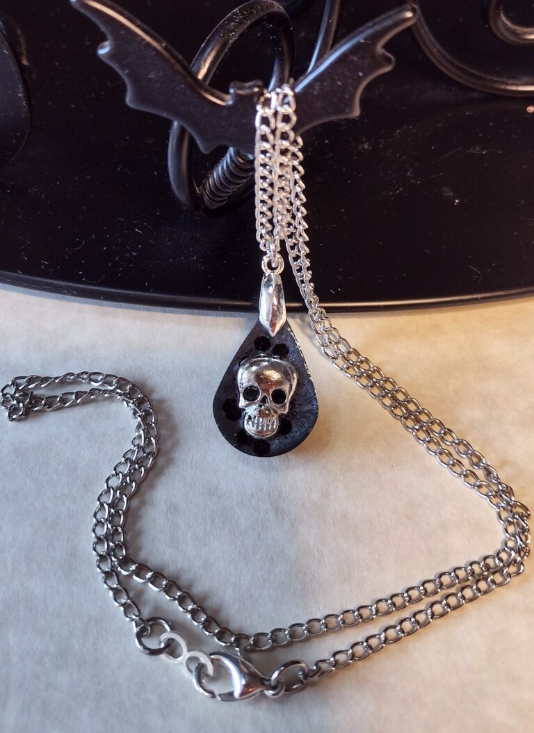 Part # 147210040 Teardrop Skull Resin Necklace with a stainless steel chain Length 20 inches Price $22.08 (1)