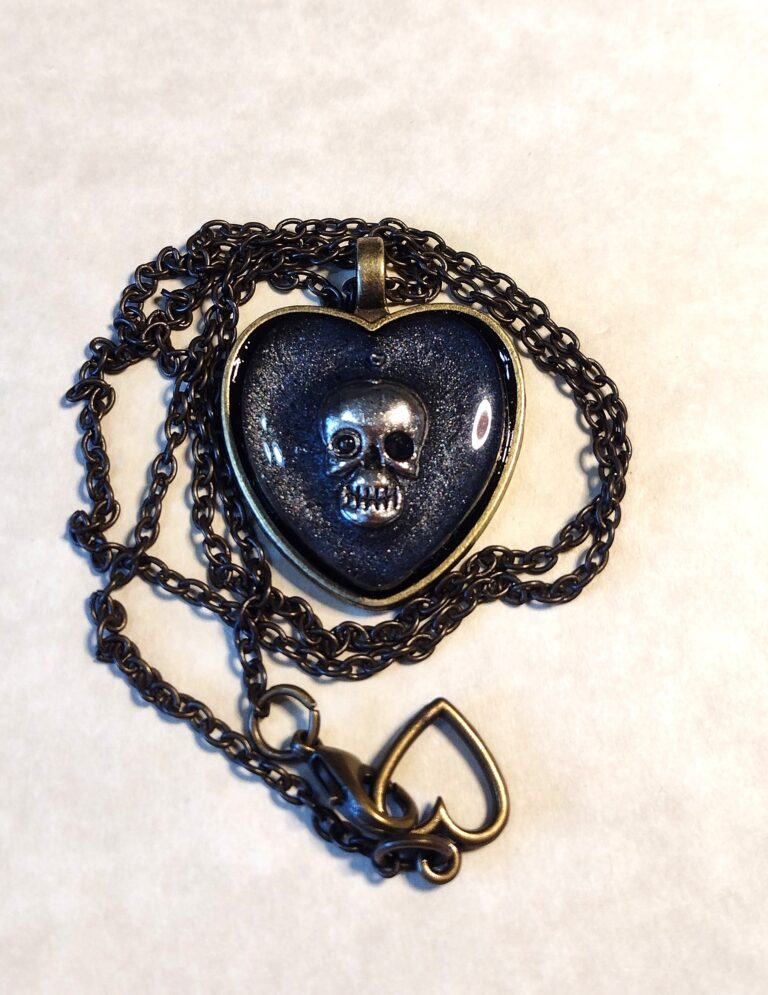 Part # 147210082 Resin Skull Heart Pendant Necklace with a stainless steel chain Length 20 inches Price $ 24.74