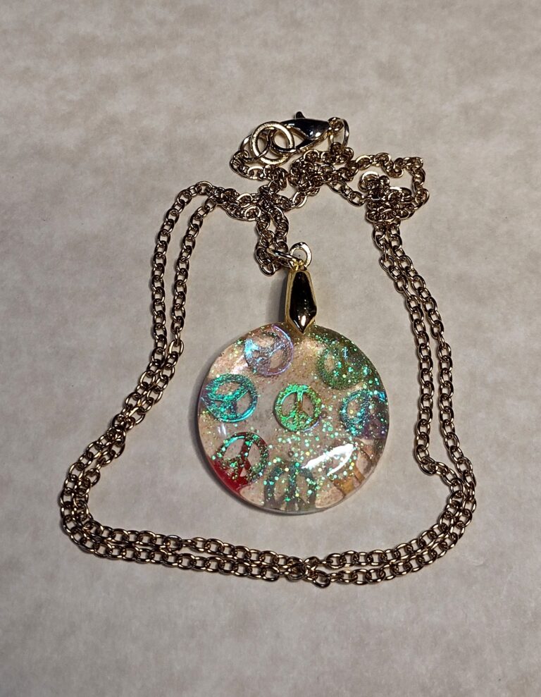 Part # 147210094 Resin Peace Sign Necklace with a stainless steel chain Length 20 inches Price $15.72